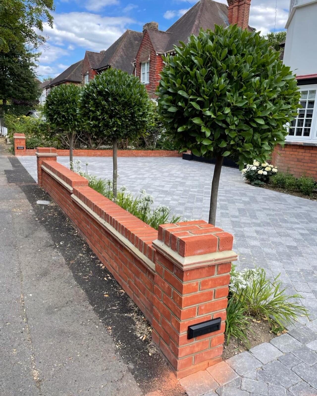 Block-paved driveway with brick edging in Surrey