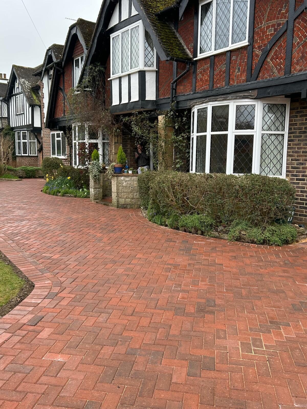 Block-paved driveway to a brick home in Surrey