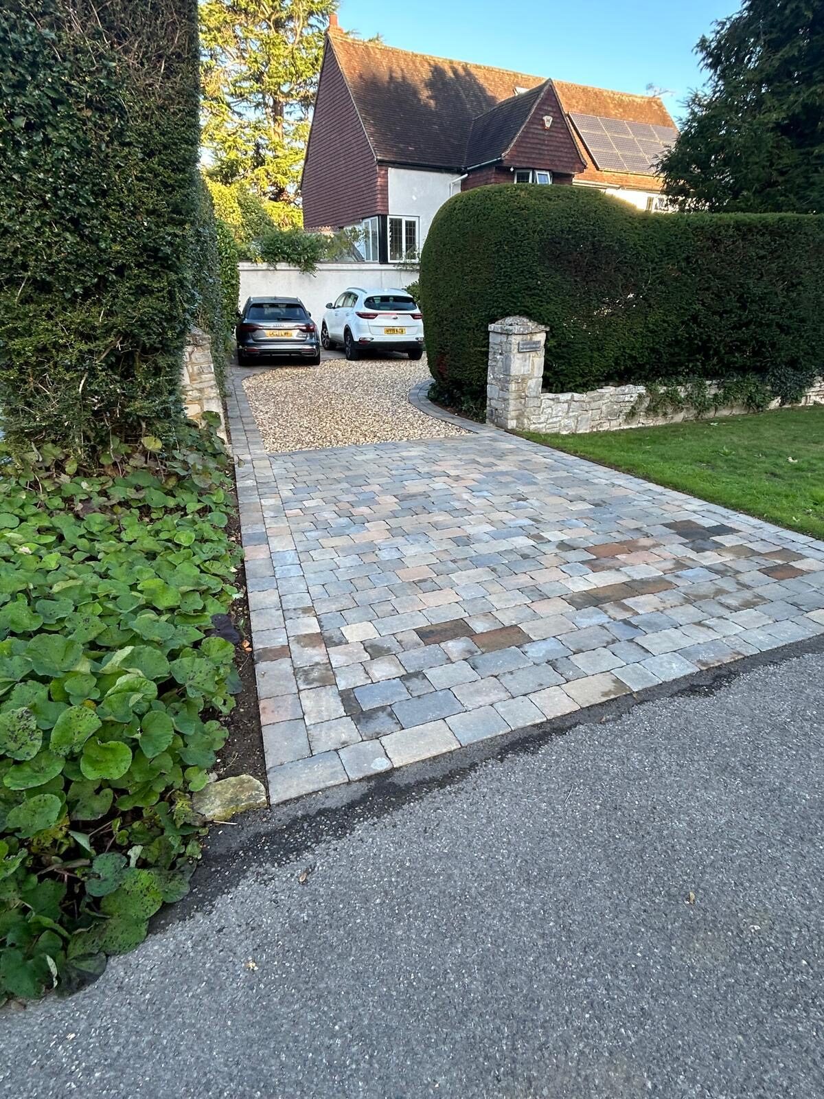Contemporary stone-paved driveway to a modern home in Surrey