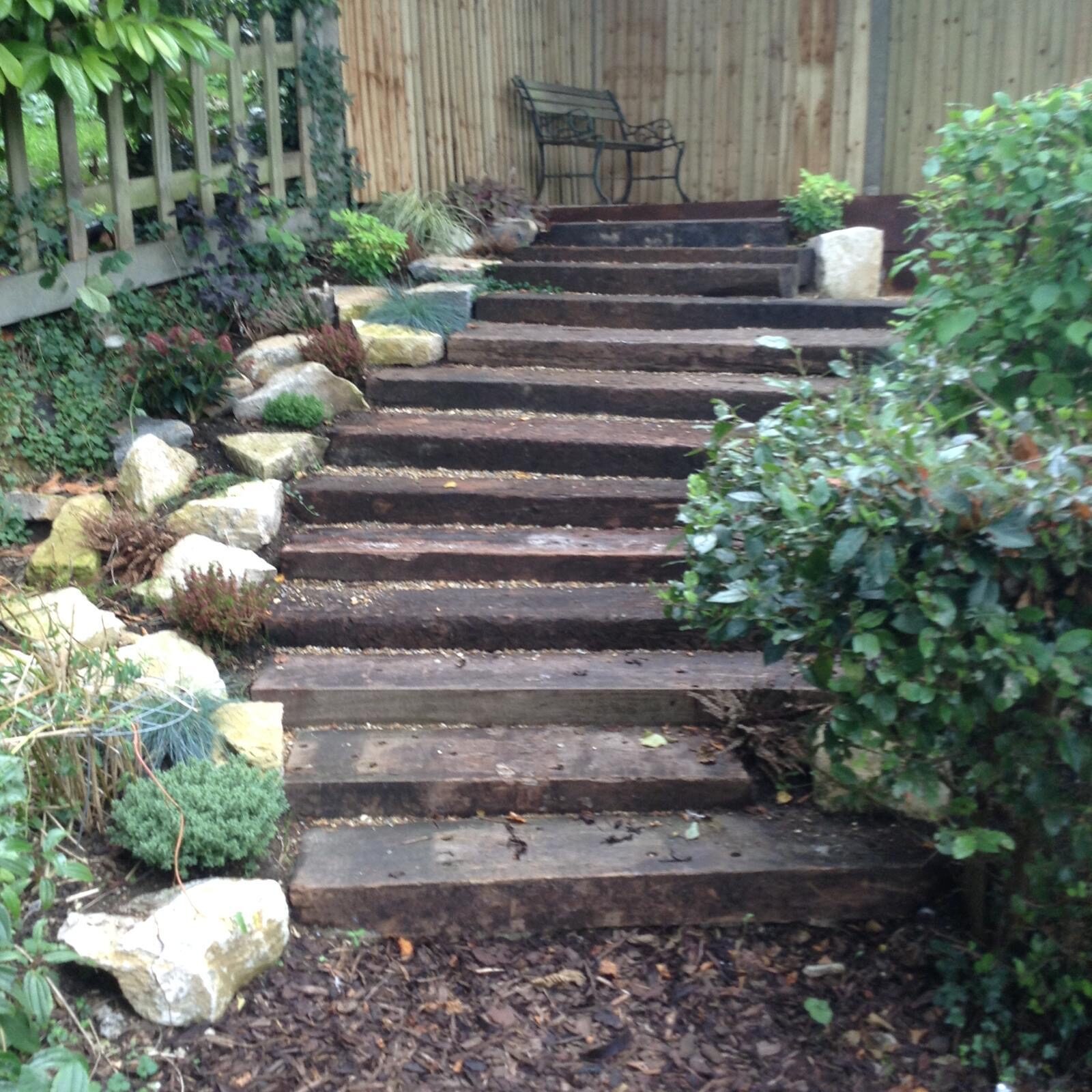 Garden steps through planted borders in Surrey