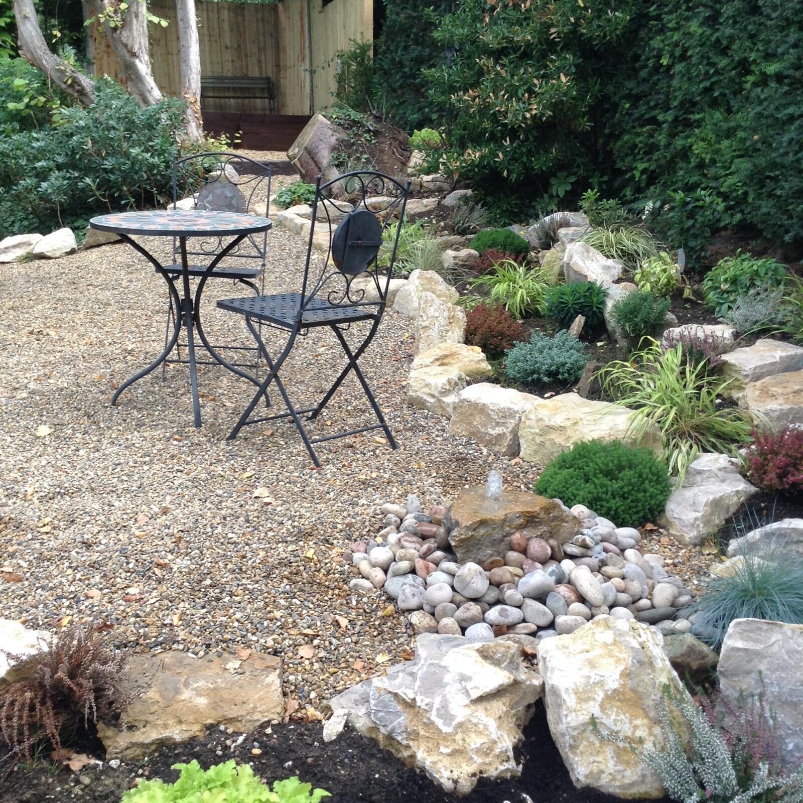 Low-maintenance gravel garden with planting in Surrey