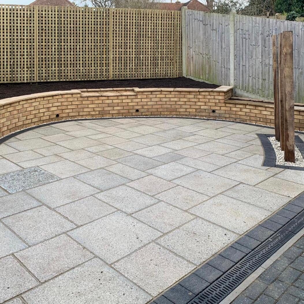 Landscaped garden with curved paving in Surrey