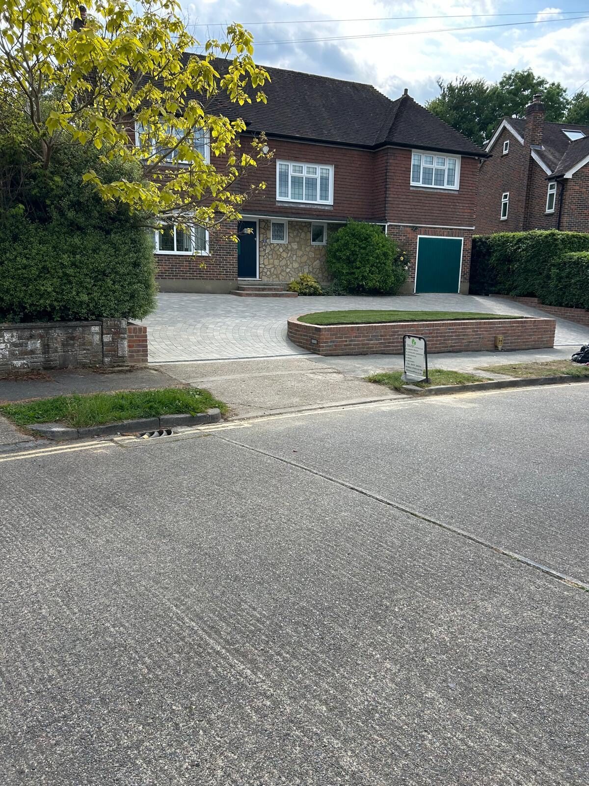 Large block-paving driveway across a house frontage in Surrey