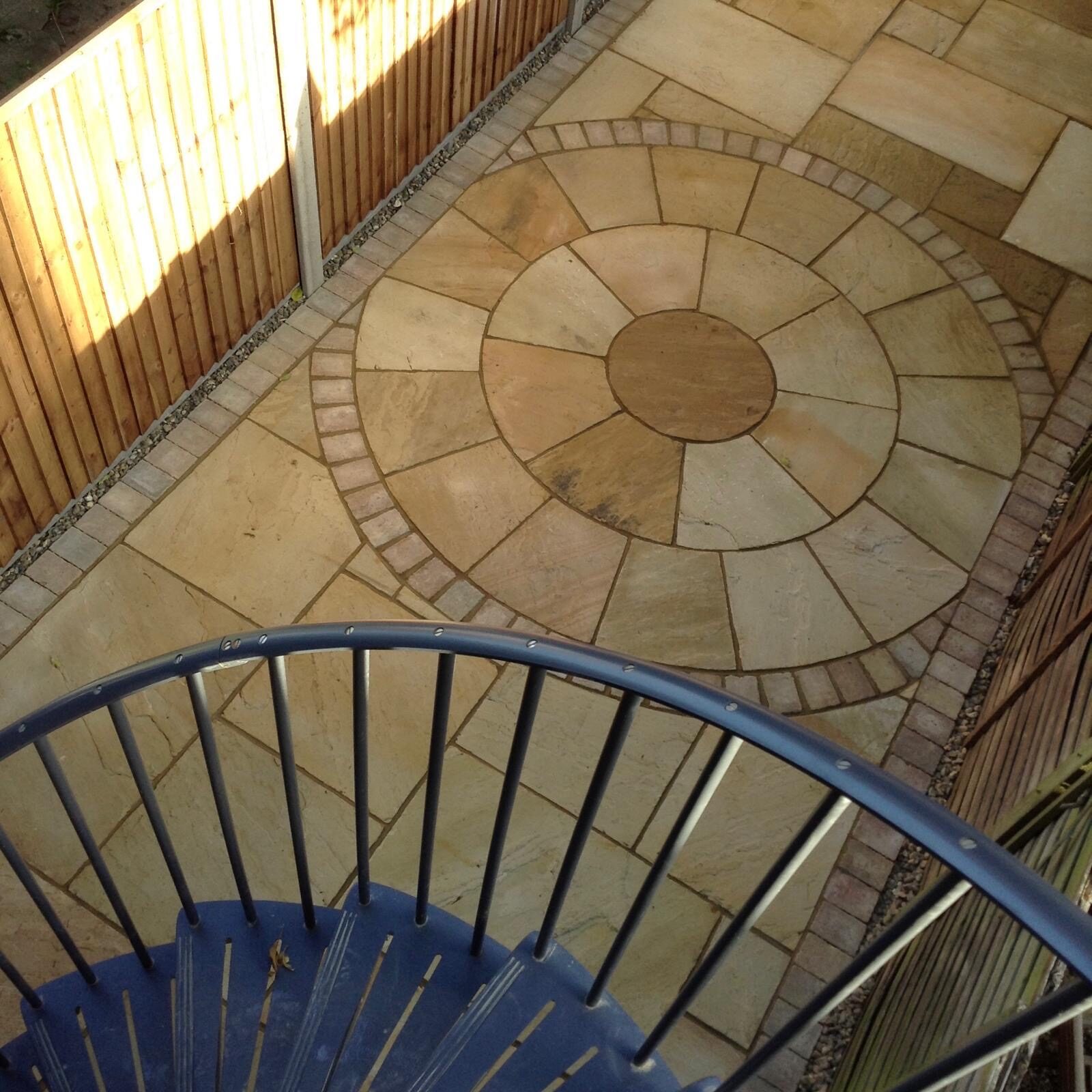 Sandstone patio with curved bullnose steps in Surrey