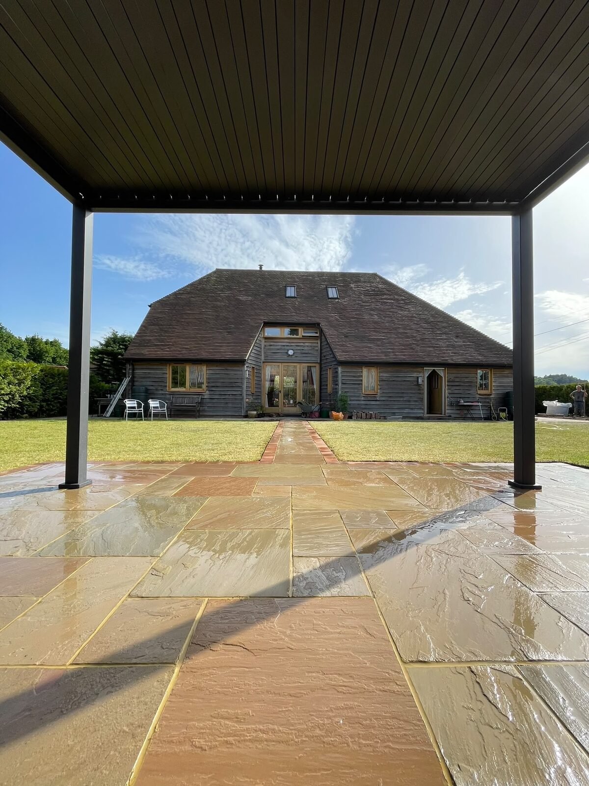 Sandstone patio with steps and border in Surrey