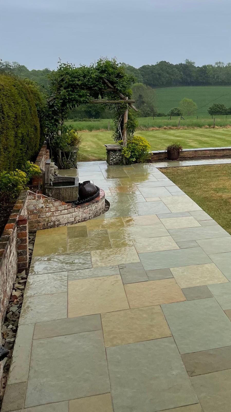 Sandstone patio with border in Surrey